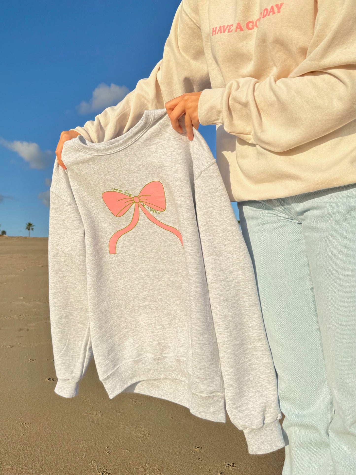 EVERY DAY IS A GIFT BOW CREWNECK